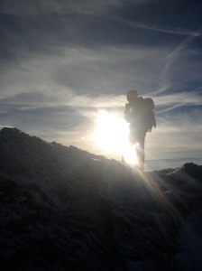 Kate silhouetted after topping out of Hour Glass Gully, Cwm Lloer, Snowdonia and putting to rest some memories.
